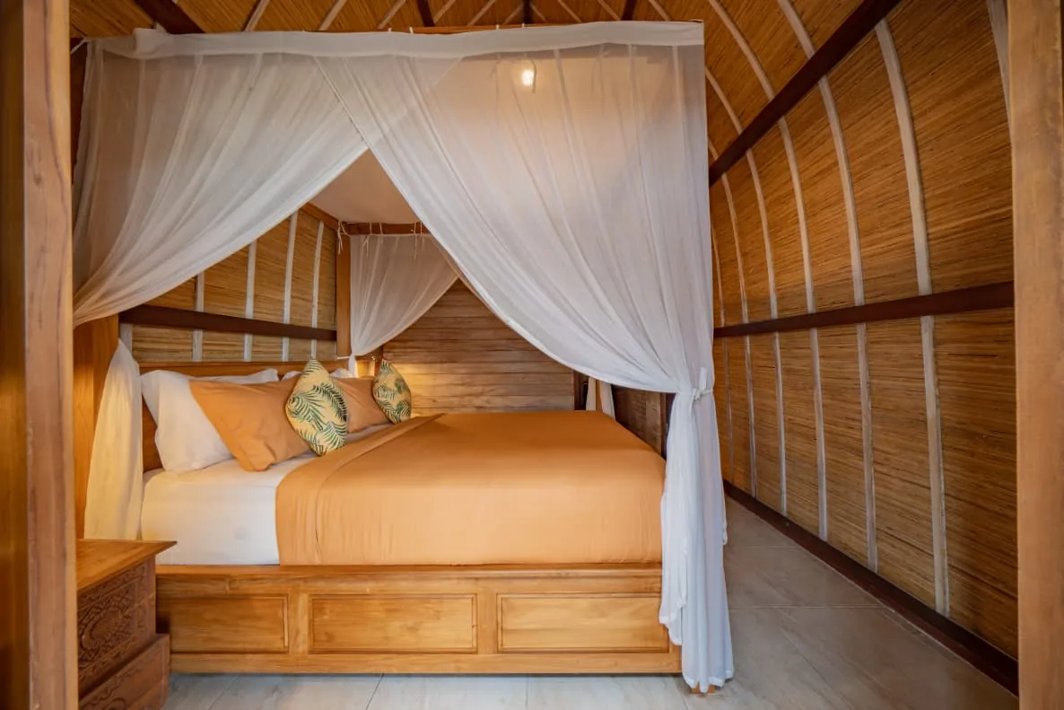 Bungalow bedroom with canopy bed, July 2026