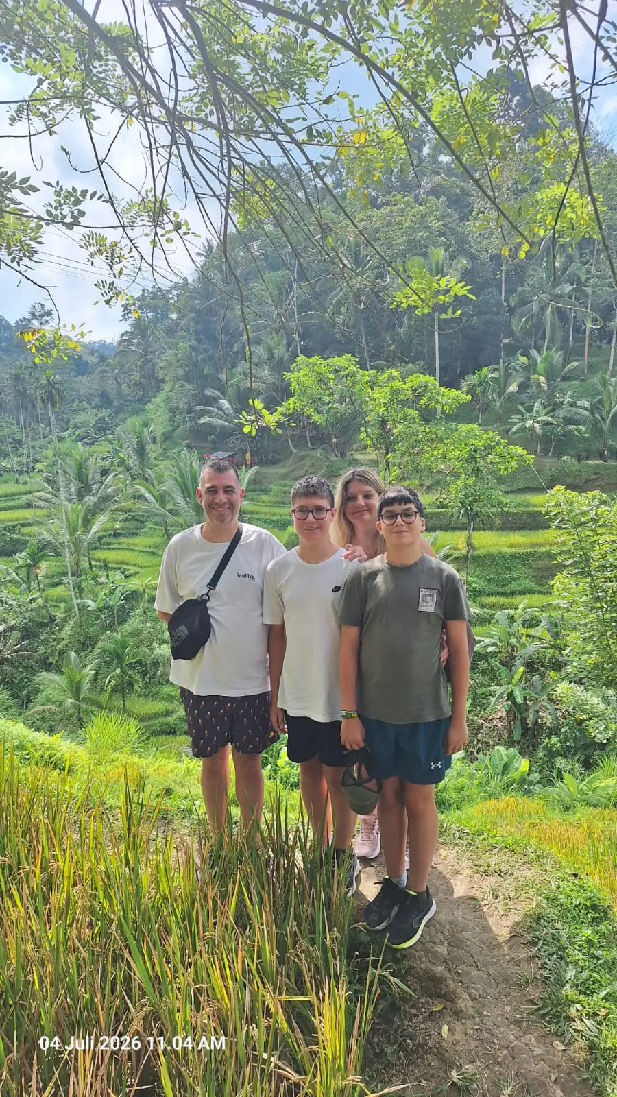 A family walk through the rice terraces, July 2026